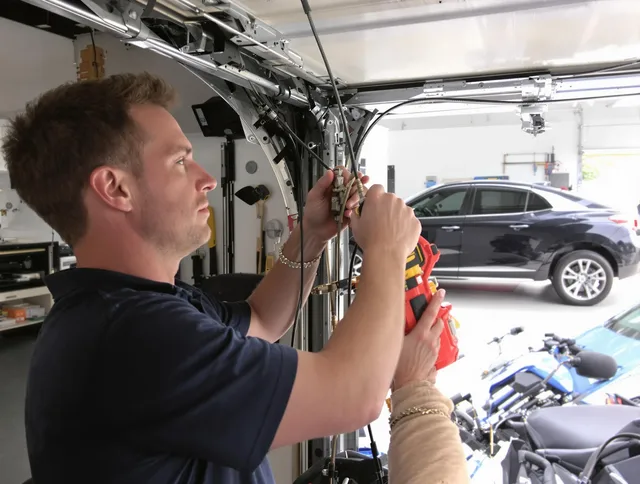 Fullerton Garage Door Repair safety certified technician performing cable replacement in Fullerton